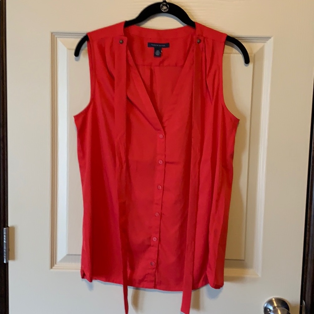 Sleeveless red blouse